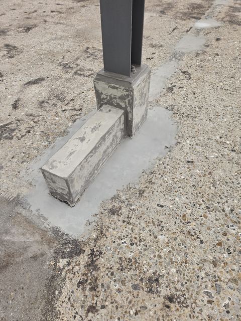 Betonherstel aan een kolomvoet op een dakterras